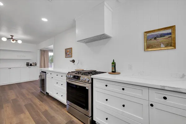 a spacious bathroom with a bathtub and a sink