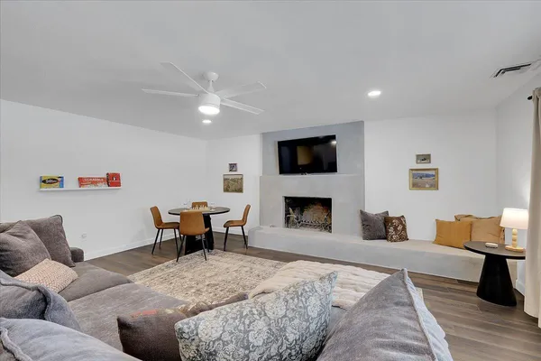 a front view of a house with patio yard and outdoor seating
