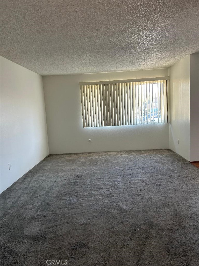2255 Cahuilla Street, Unit 90 Colton, CA 92324 - Photo 2 of 12 an empty room with a window