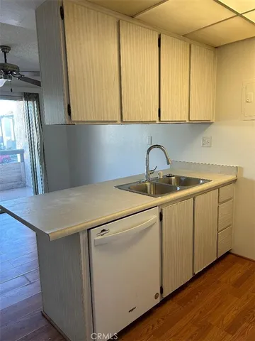 a utility room with cabinets washer and dryer