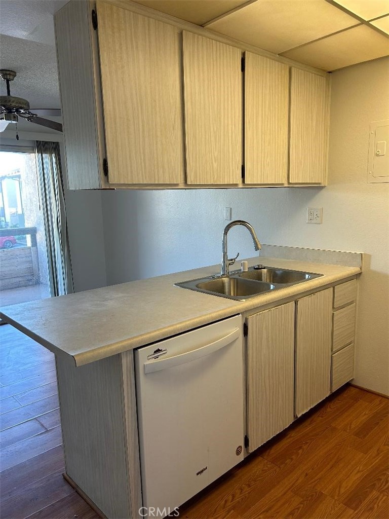 2255 Cahuilla Street, Unit 90 Colton, CA 92324 - Photo 5 of 12 a utility room with cabinets washer and dryer