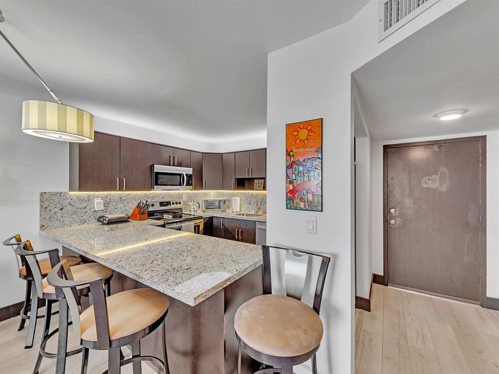 1421 South Ocean Boulevard, Unit 506 Pompano Beach, FL 33062 - Photo 11 of 36 a view of a dining room with furniture