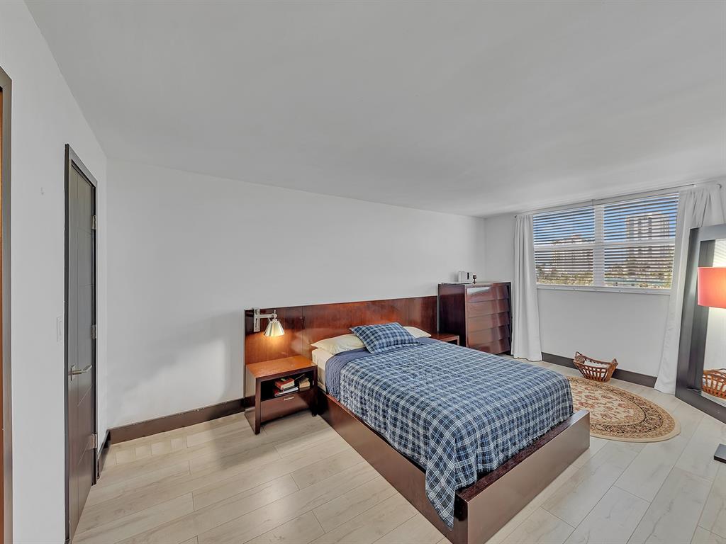 1421 South Ocean Boulevard, Unit 506 Pompano Beach, FL 33062 - Photo 23 of 36 a bedroom with a bed and window