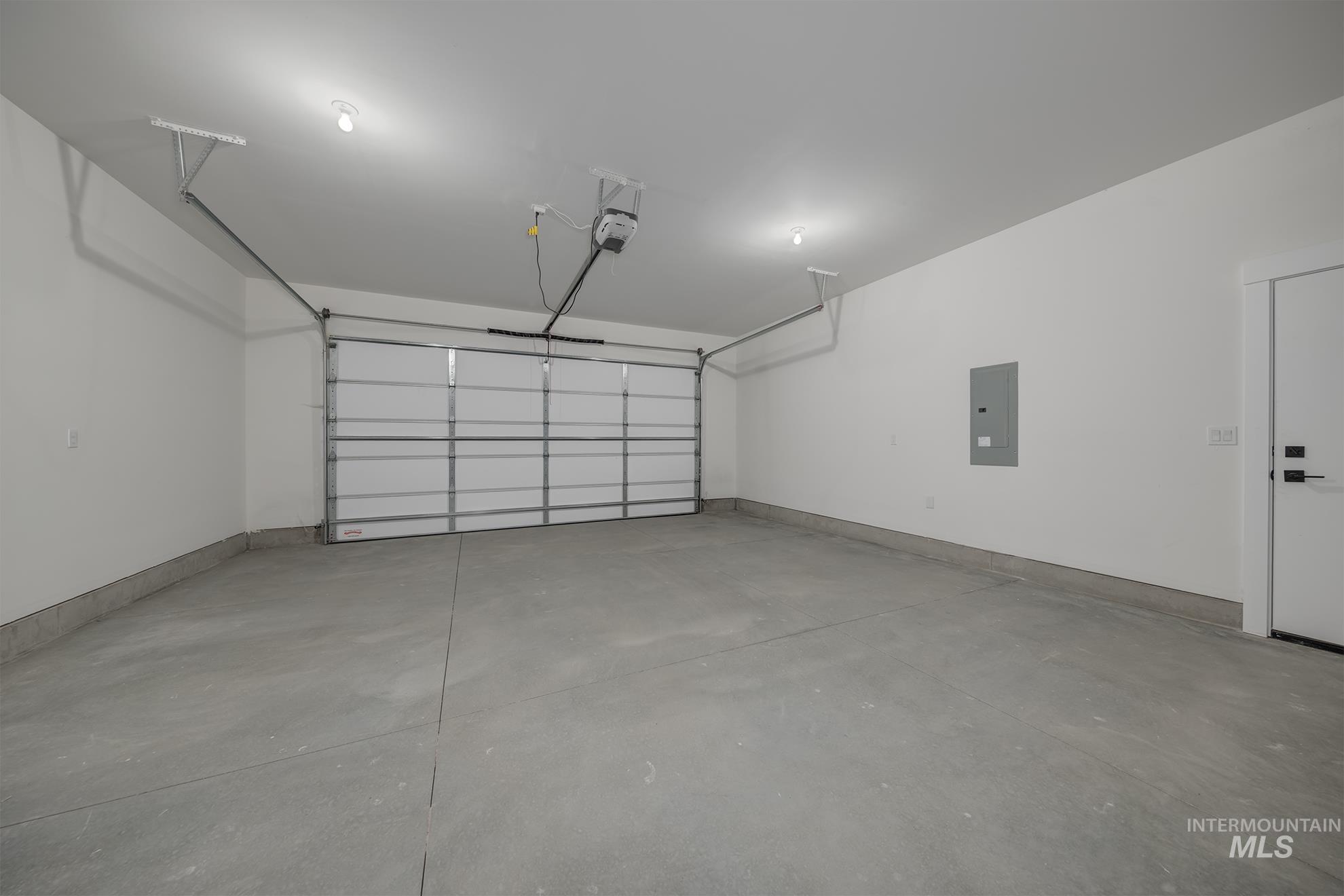 1371 Hansen Road Weiser, ID 83672 - Photo 31 of 44 Attached garage with concrete flooring, automatic garage door, and recessed lighting