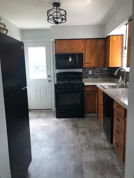 181 Hinkel Road Pittsburgh, PA 15229 - Photo 3 of 18 Kitchen with new counter top,back splash,sink,flooring, and light fixtures.