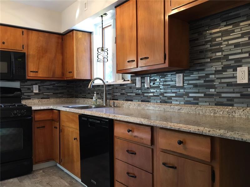 181 Hinkel Road Pittsburgh, PA 15229 - Photo 4 of 18 Updated kitchen counter top, back splash, sink, dishwasher, light fixtures, and floor.