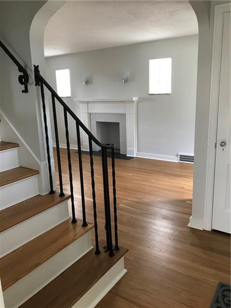 181 Hinkel Road Pittsburgh, PA 15229 - Photo 7 of 18 View of living room with hardwood floors and freshly painted.
