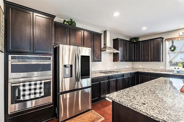 a kitchen with a table and chairs in it