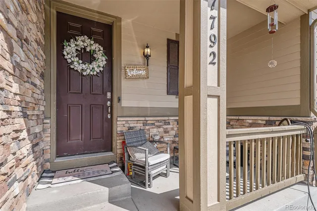 a view of entryway with wooden floor and stairs