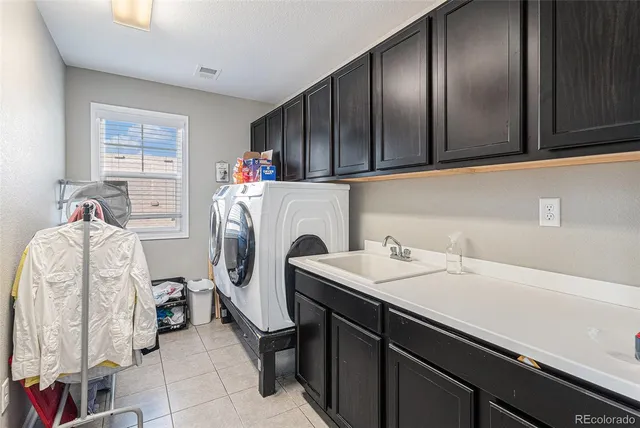 a bedroom with furniture and a wooden floor