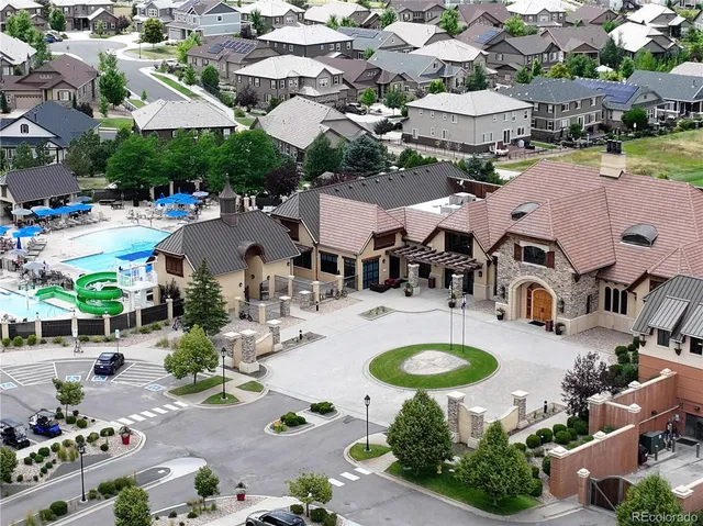 an aerial view of a houses with yard