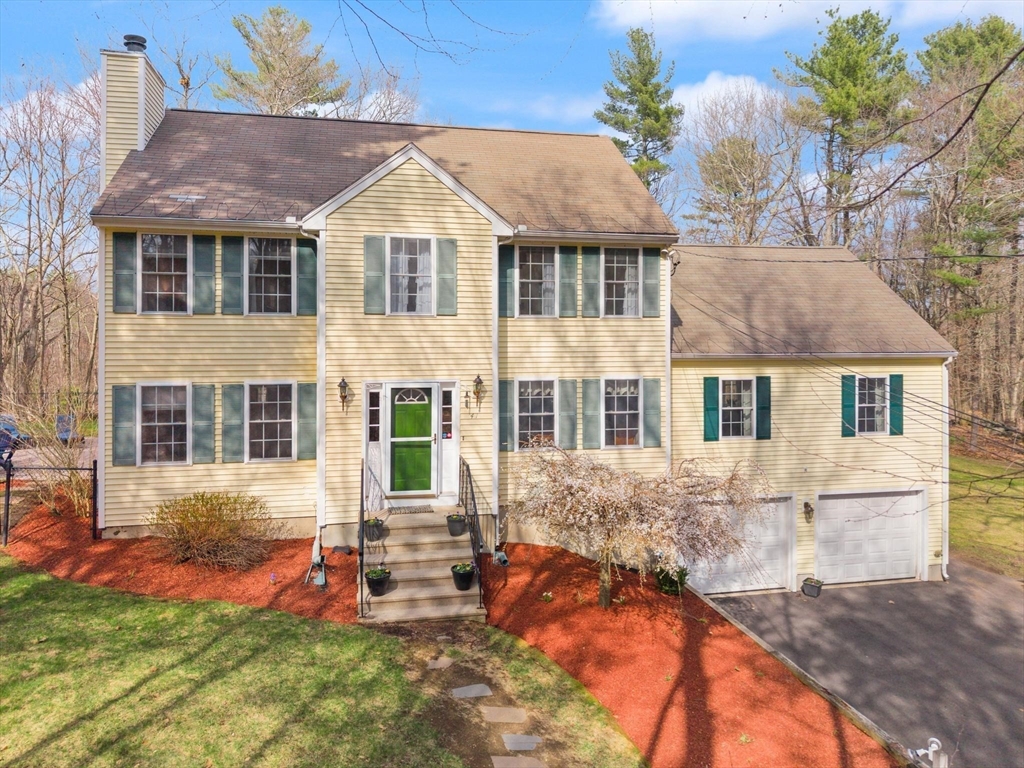 41 Chestnut Road Tyngsborough, MA 01879 - Photo 1 of 32 a front view of a house with a yard