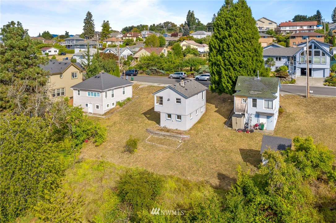 709 Renton Avenue South Renton, WA 98057 - Photo 9 of 13 an aerial view of residential houses with outdoor space and trees