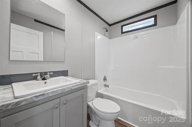 a view of a room with wooden floor and closet