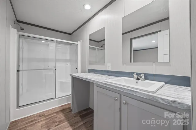 a kitchen with a refrigerator stove and white cabinets