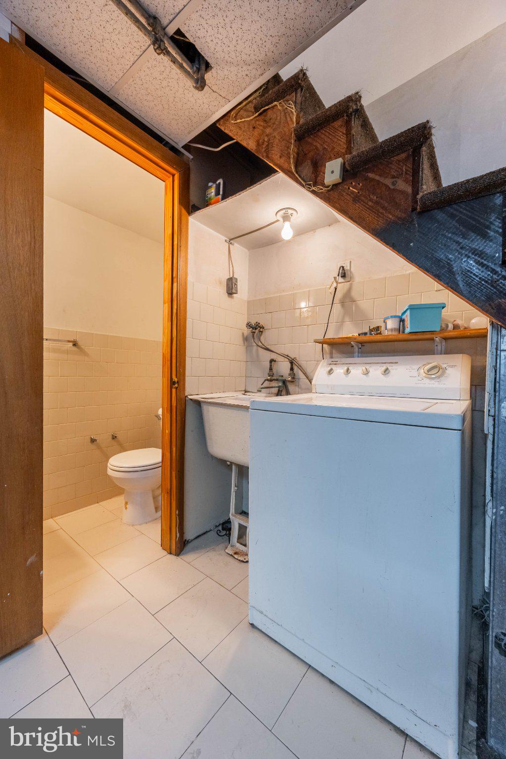 6043 North 3rd Street Philadelphia, PA 19120 - Photo 22 of 27 Functional laundry nook with charm.