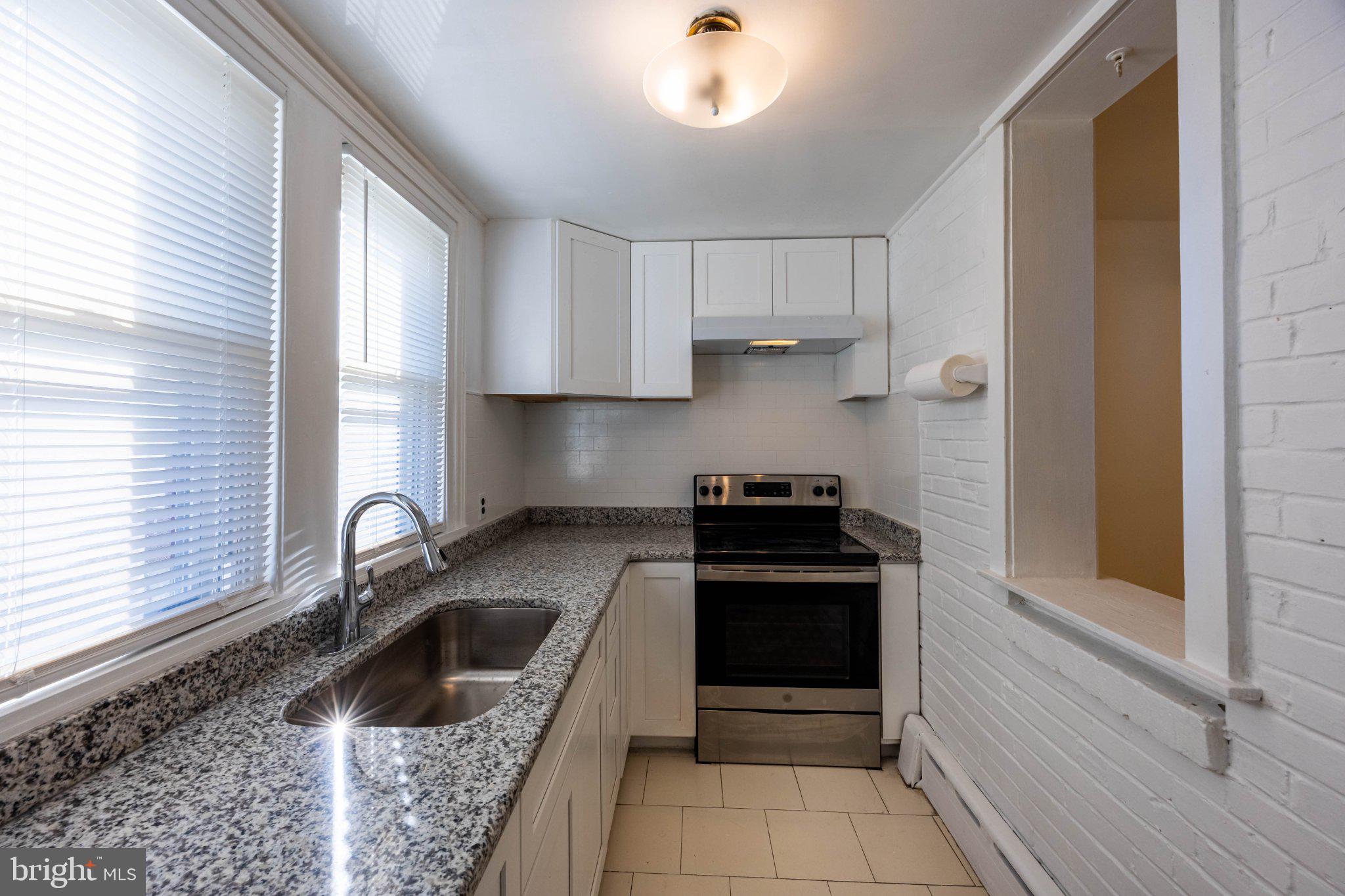 6043 North 3rd Street Philadelphia, PA 19120 - Photo 10 of 27 Bright and modern kitchen space.