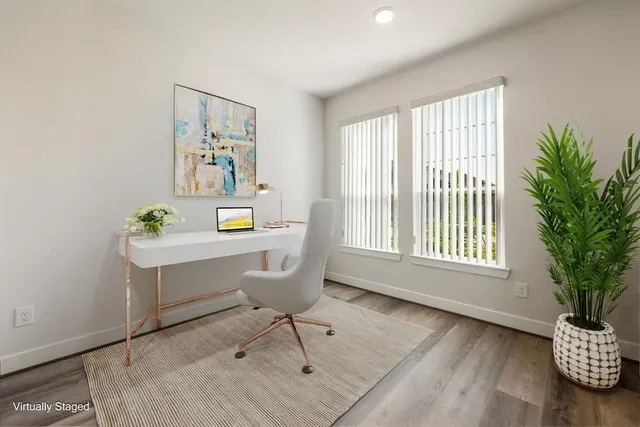 a workspace with furniture and a window