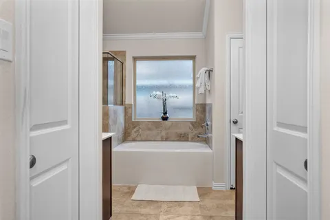 a bathroom with a bathtub and a shower