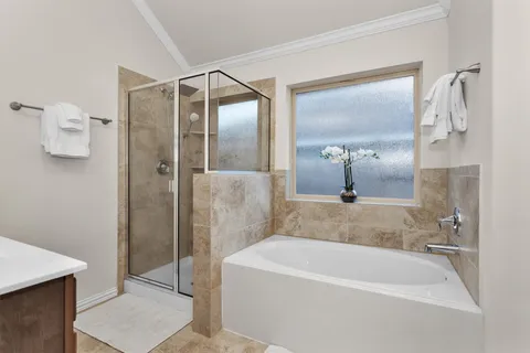 a bathroom with a bathtub and a sink