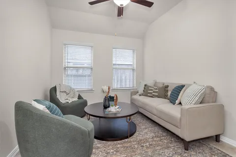 a living room with furniture and a window