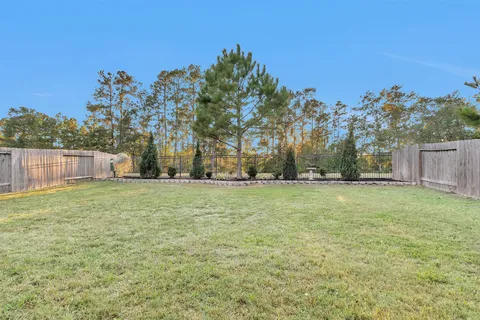 a backyard of a house with lots of green space