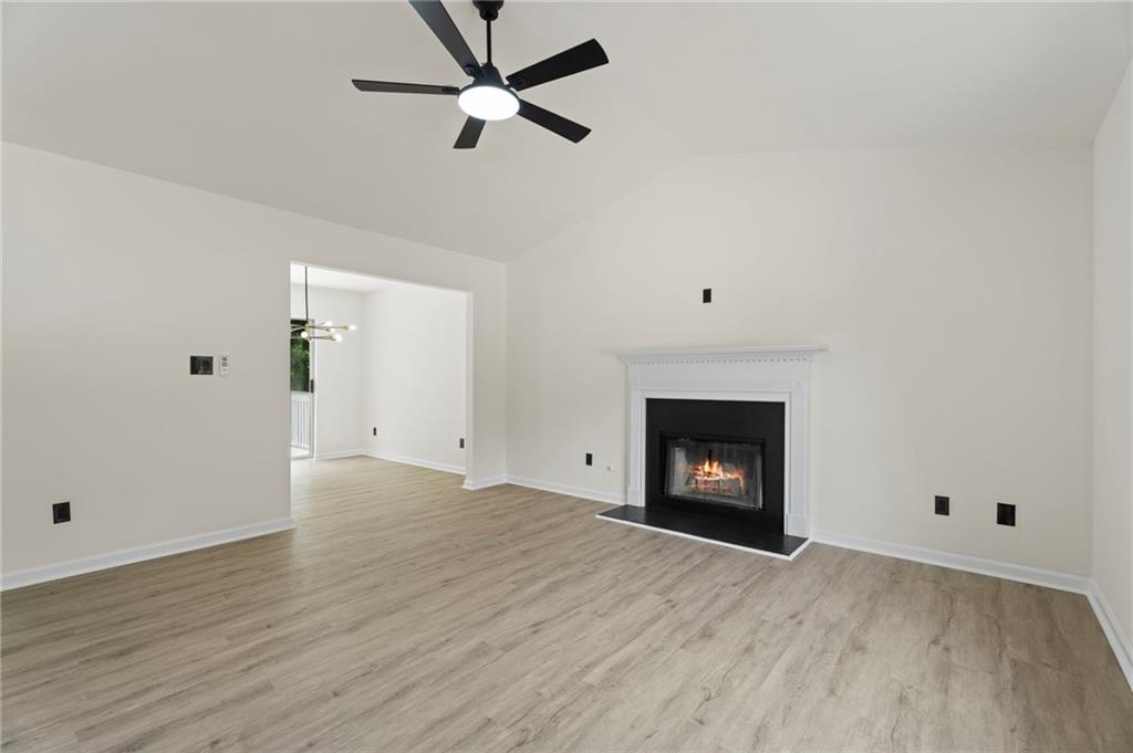 3602 Bristol Overlook Rex, GA 30273 - Photo 8 of 37 wooden floor in an empty room with a fireplace