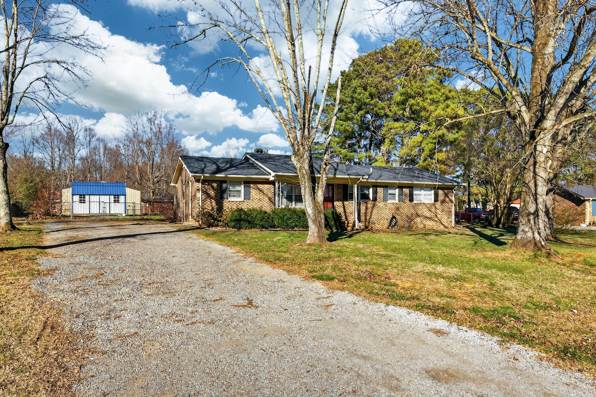 3 Park City Heights Road Fayetteville, TN 37334 - Photo 29 of 32 a front view of a house with a garden and trees