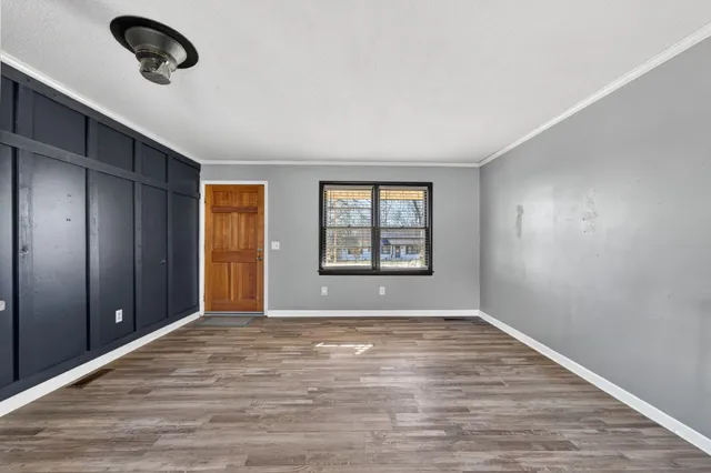 a view of an empty room with a window