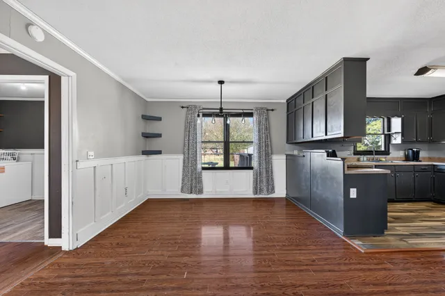 a view of a kitchen cabinets and wooden floor