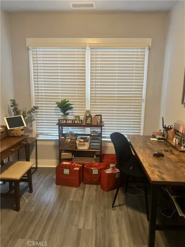 a workspace with furniture and window