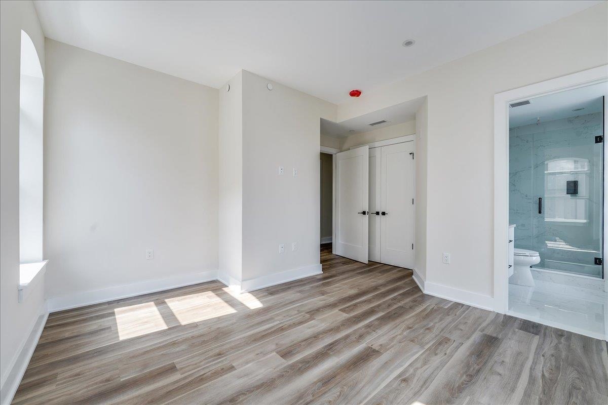 237 Washington Street, Unit 304 Hoboken, NJ 07030 - Photo 17 of 34 wooden floor in an empty room