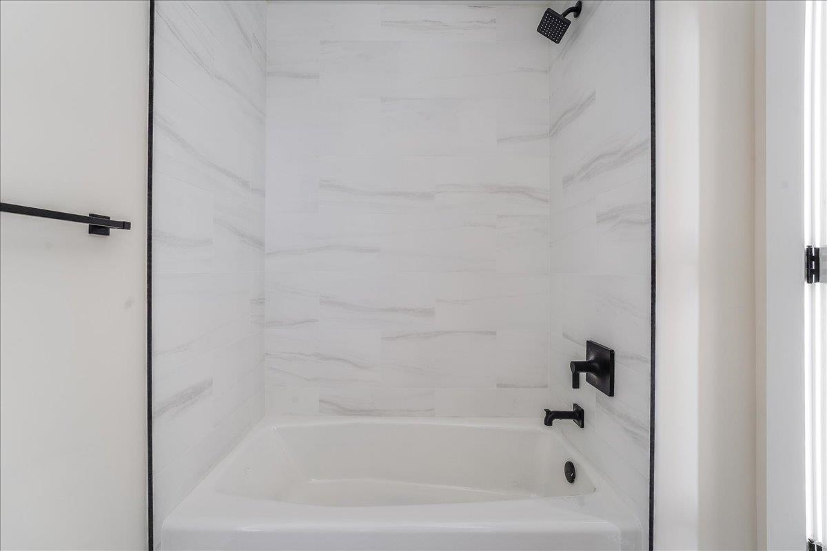 237 Washington Street, Unit 304 Hoboken, NJ 07030 - Photo 8 of 34 a close up of a bathtub curtain