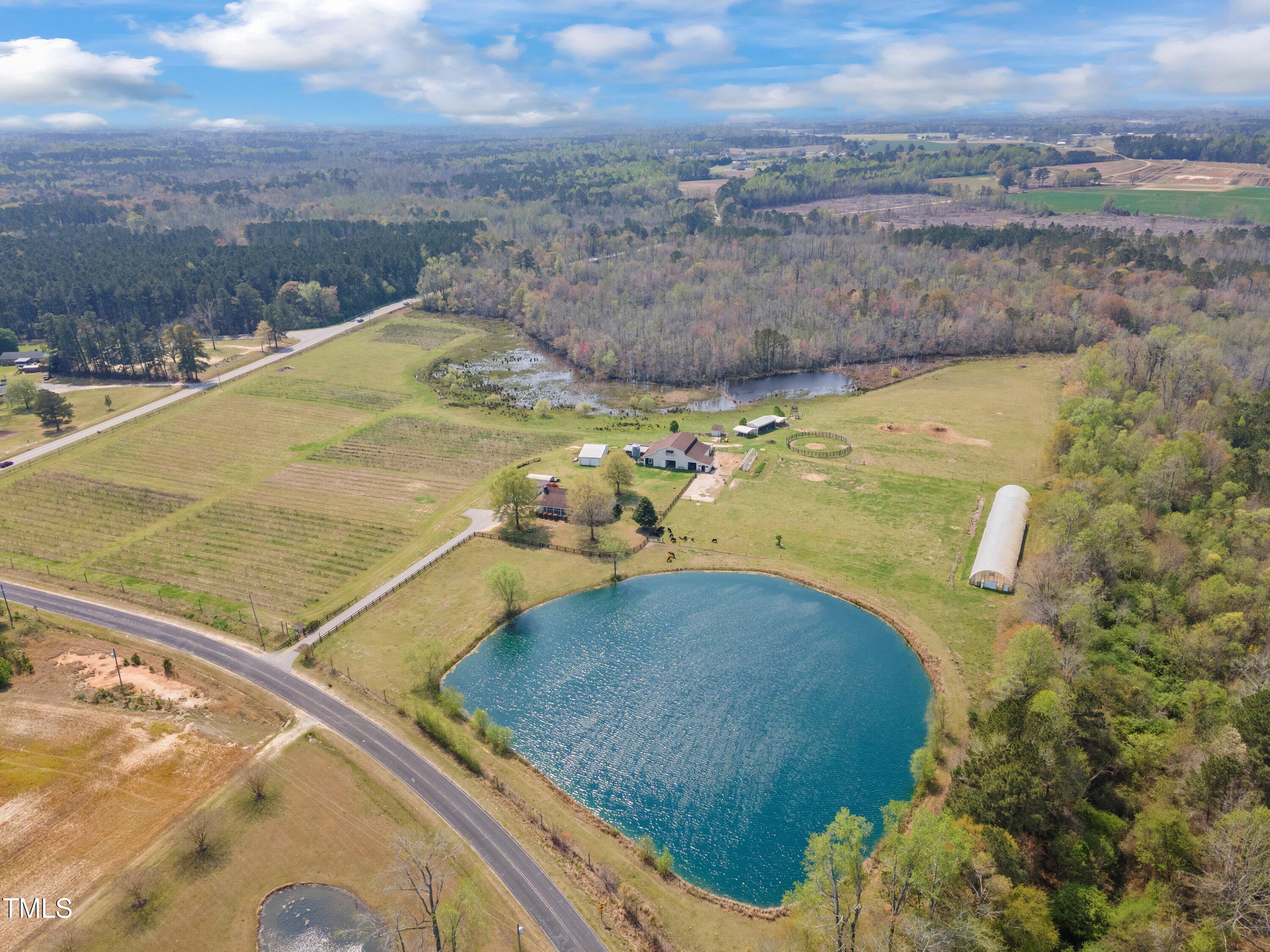 97 Bailey Road Coats, NC 27521 - Photo 1 of 43 Aerial View of Farm, with Pond/Greenhouse/Barn