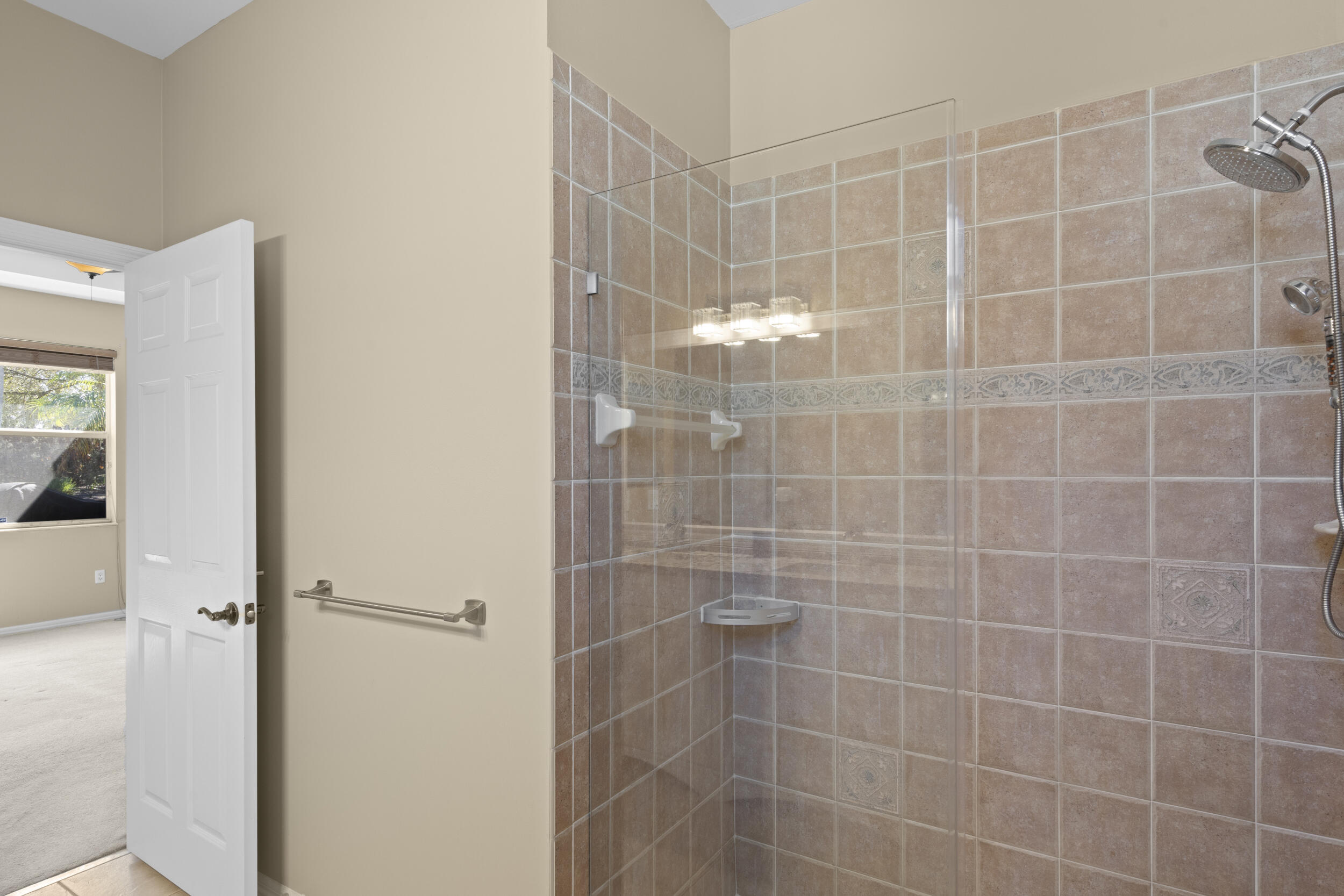333 Southwest Coconut Key Way Port St. Lucie, FL 34986 - Photo 28 of 52 Walk in shower with elegant glass door