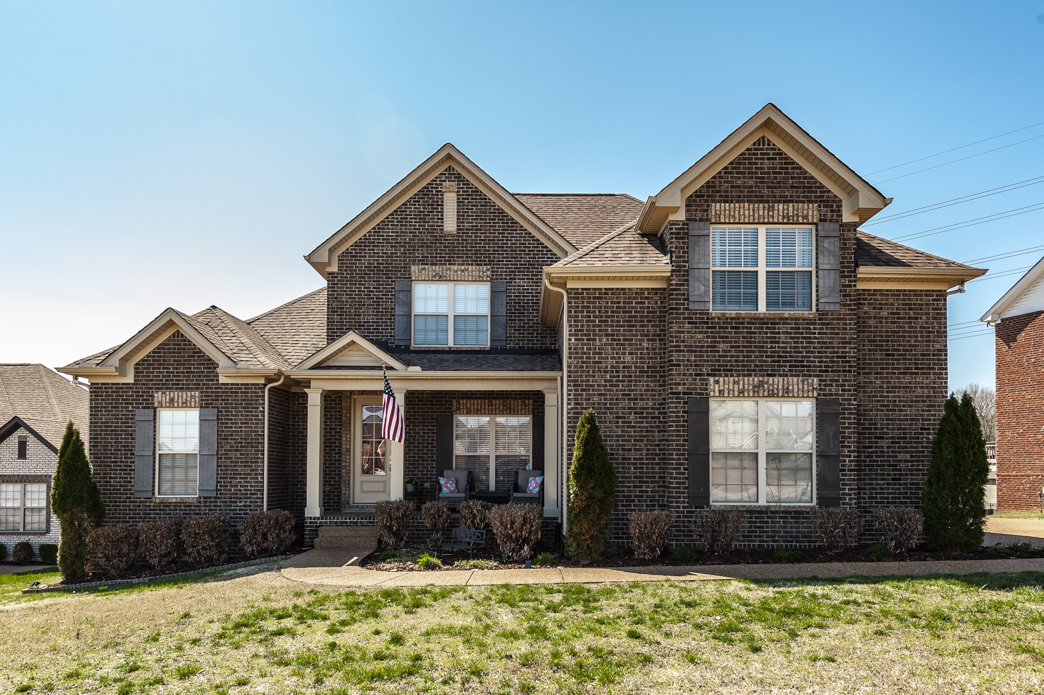 a front view of a house with a yard