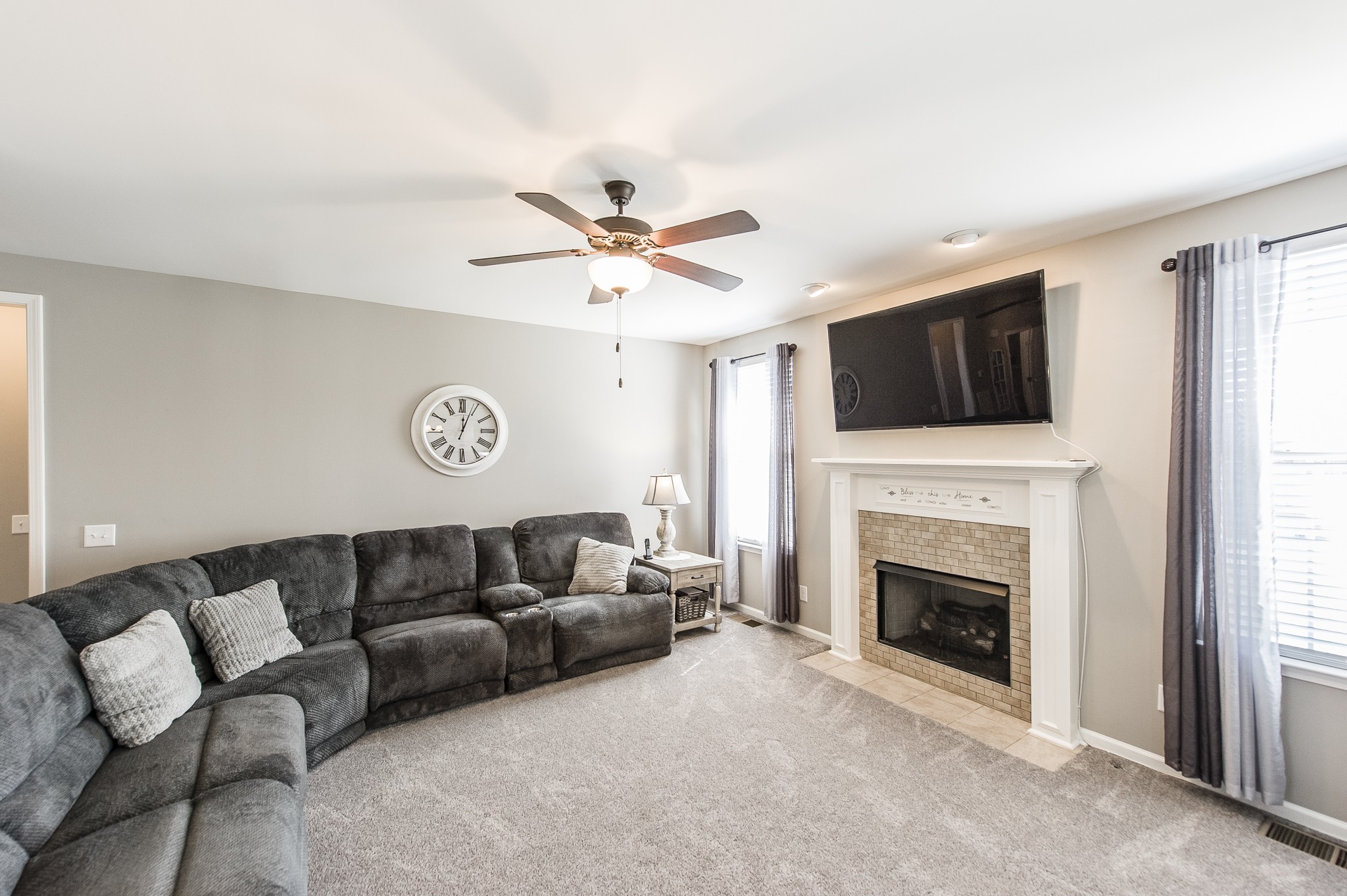 114 Monteview Drive Hendersonville, TN 37075 - Photo 11 of 42 a living room with furniture a fireplace and a flat screen tv