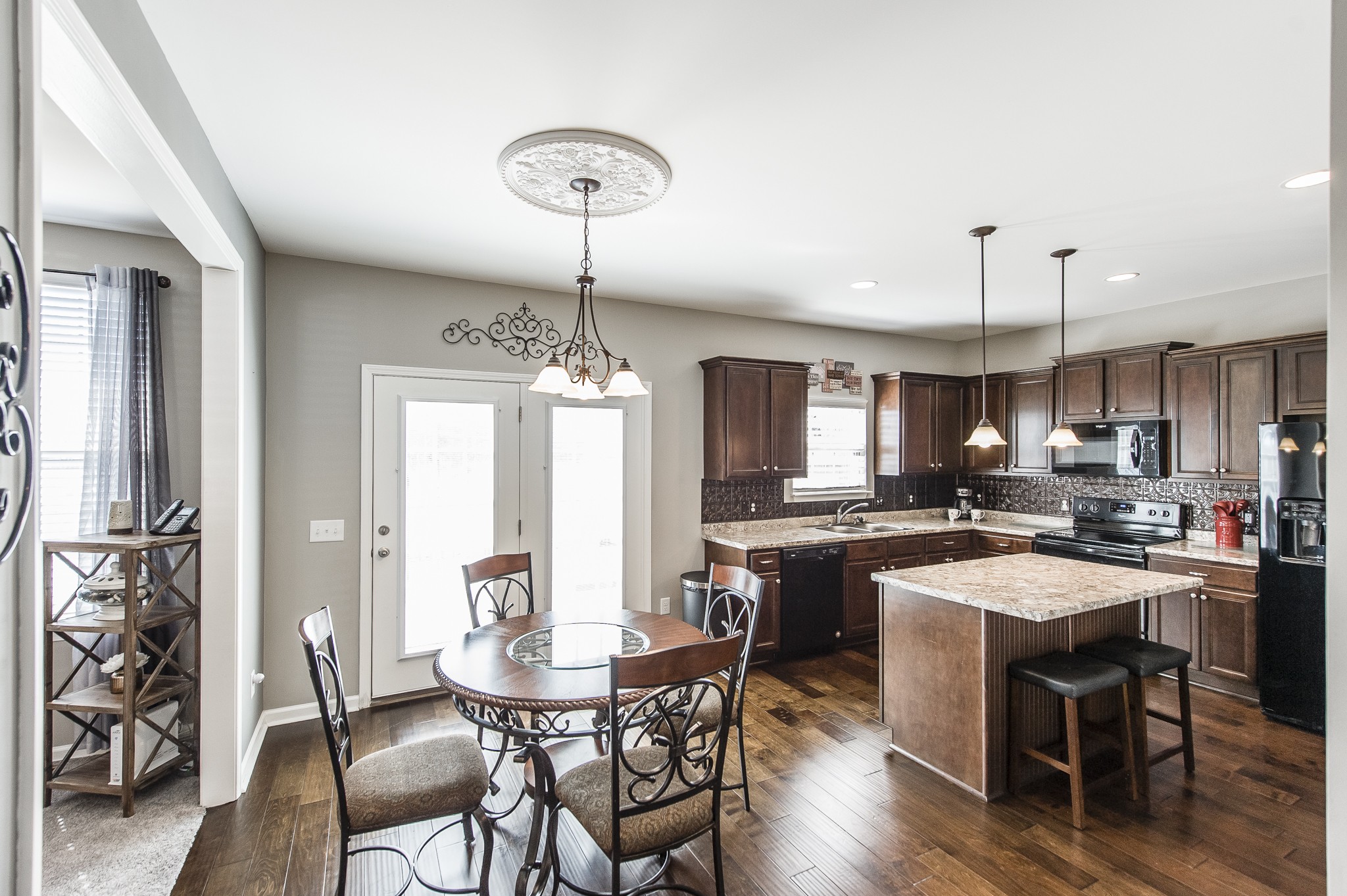 114 Monteview Drive Hendersonville, TN 37075 - Photo 15 of 42 a kitchen with a dining table chairs and refrigerator