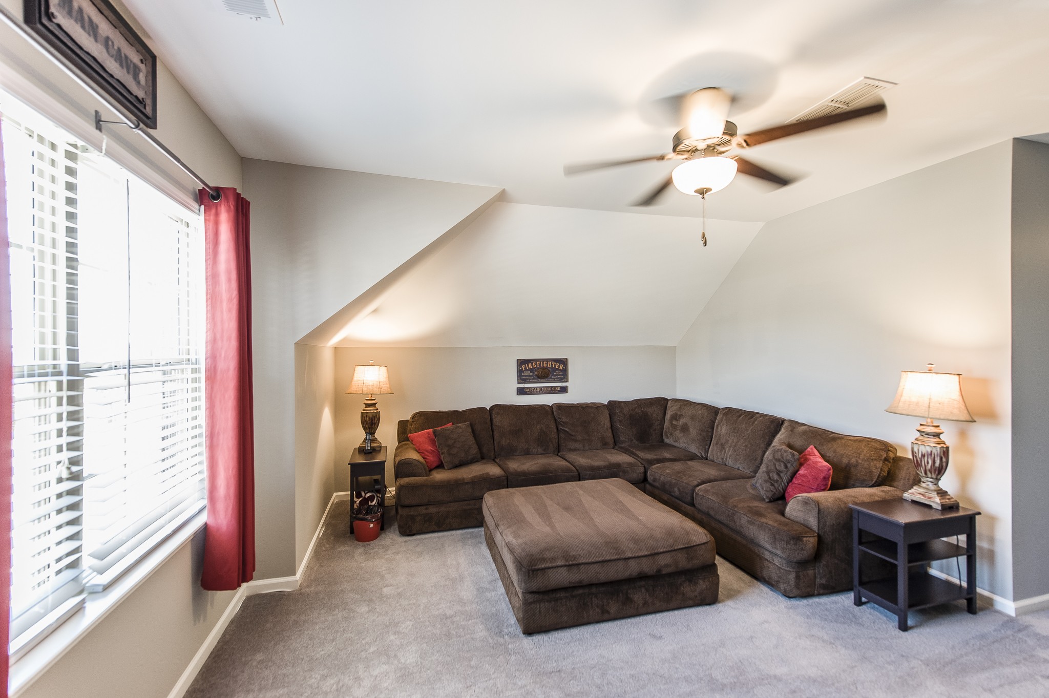 114 Monteview Drive Hendersonville, TN 37075 - Photo 28 of 42 a living room with furniture a chandelier and a window