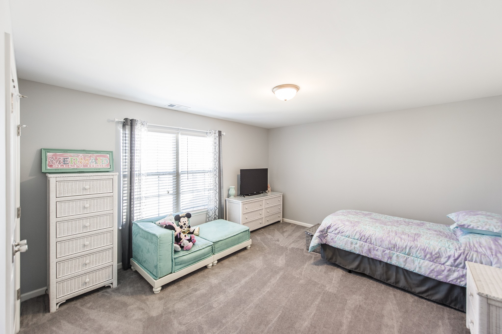 114 Monteview Drive Hendersonville, TN 37075 - Photo 31 of 42 a bedroom with a bed and a window