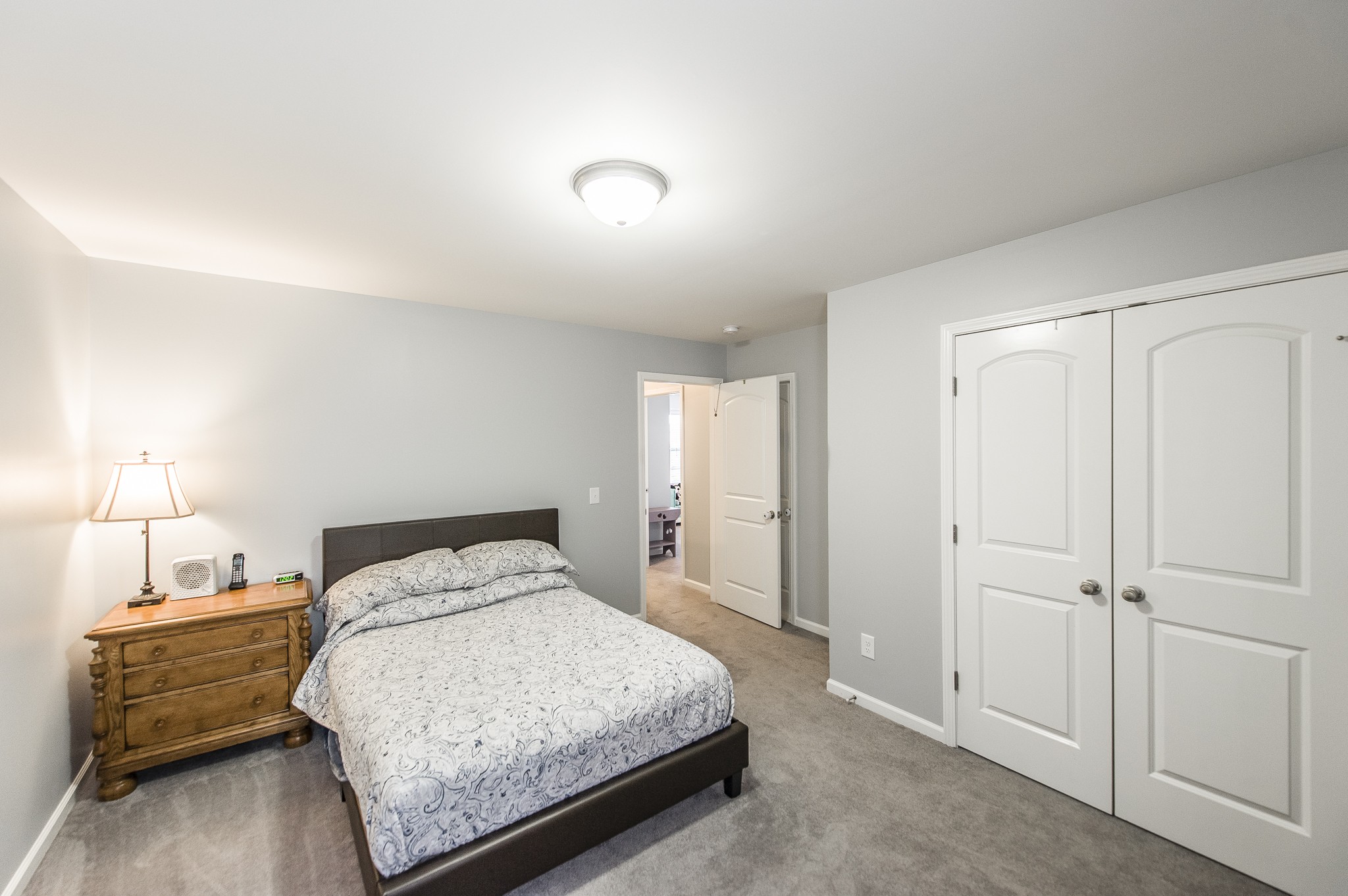 114 Monteview Drive Hendersonville, TN 37075 - Photo 35 of 42 a bedroom with a bed and a night stand