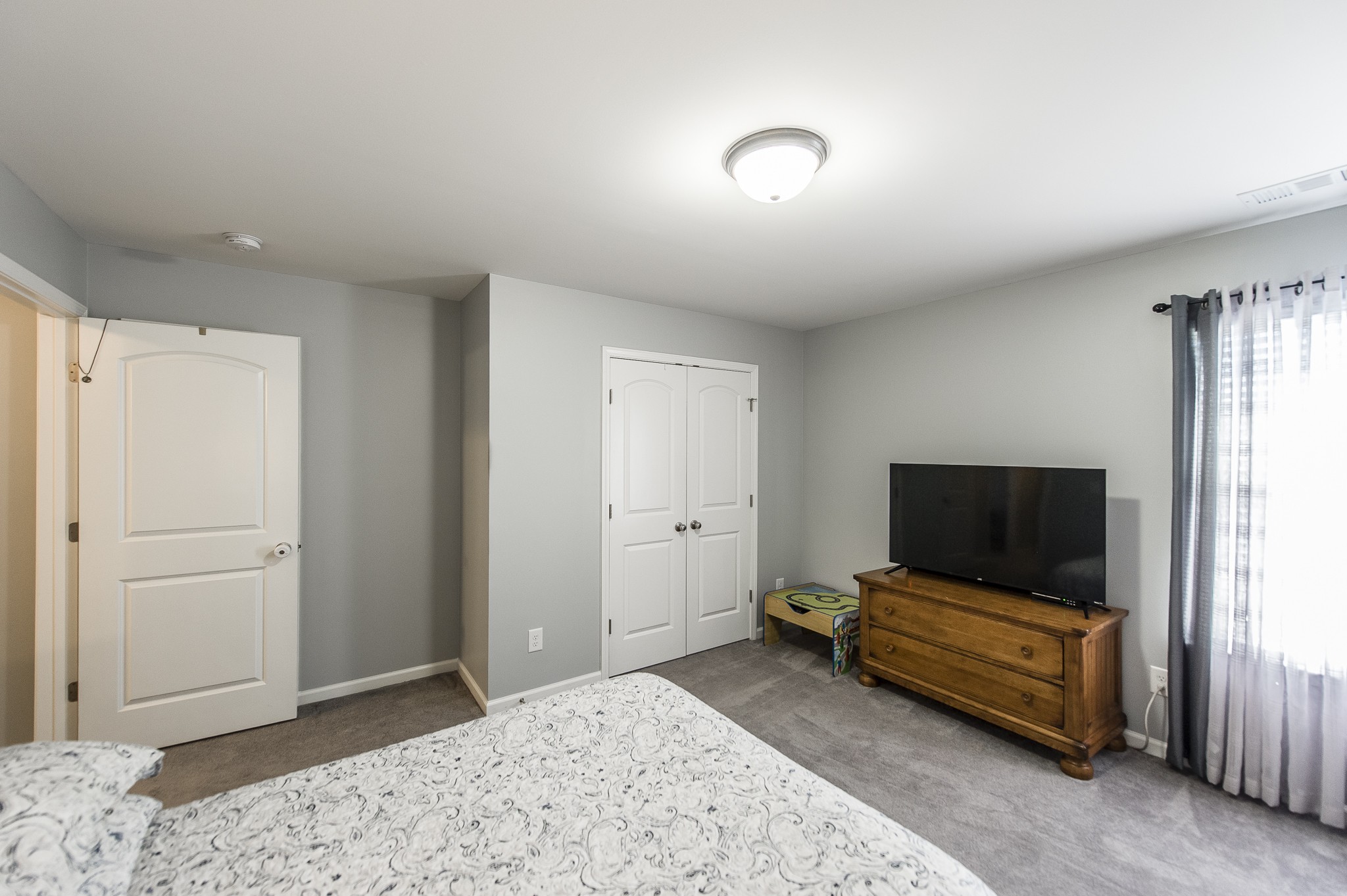 114 Monteview Drive Hendersonville, TN 37075 - Photo 36 of 42 a bedroom with furniture and a flat screen tv