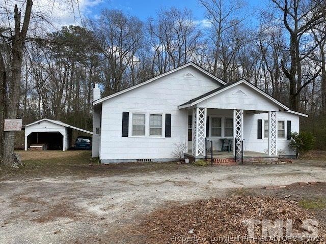838 Jada Allen Road Dunn, NC 28334 - Photo 1 of 25 a view of a house with a yard and large tree