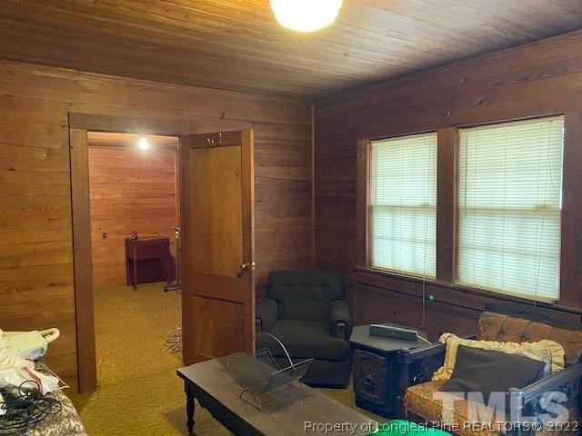 838 Jada Allen Road Dunn, NC 28334 - Photo 11 of 25 a view of a livingroom with furniture and windows