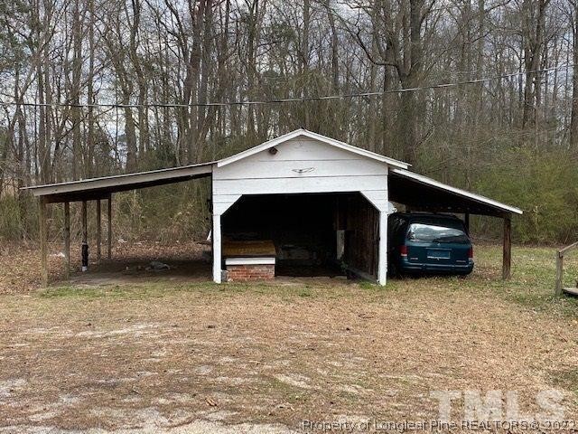 838 Jada Allen Road Dunn, NC 28334 - Photo 19 of 25 a house with trees in the background