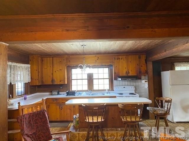 838 Jada Allen Road Dunn, NC 28334 - Photo 2 of 25 a view of kitchen with granite countertop window and dining table