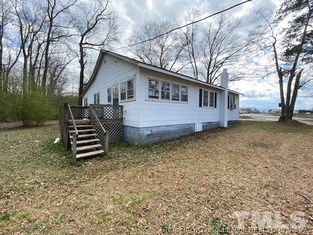 838 Jada Allen Road Dunn, NC 28334 - Photo 22 of 25 a front view of a house with a garden