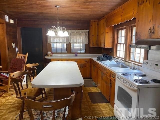 838 Jada Allen Road Dunn, NC 28334 - Photo 3 of 25 a kitchen with stainless steel appliances granite countertop a sink a stove and a wooden floors