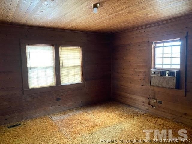 838 Jada Allen Road Dunn, NC 28334 - Photo 7 of 25 a view of an empty room and a window