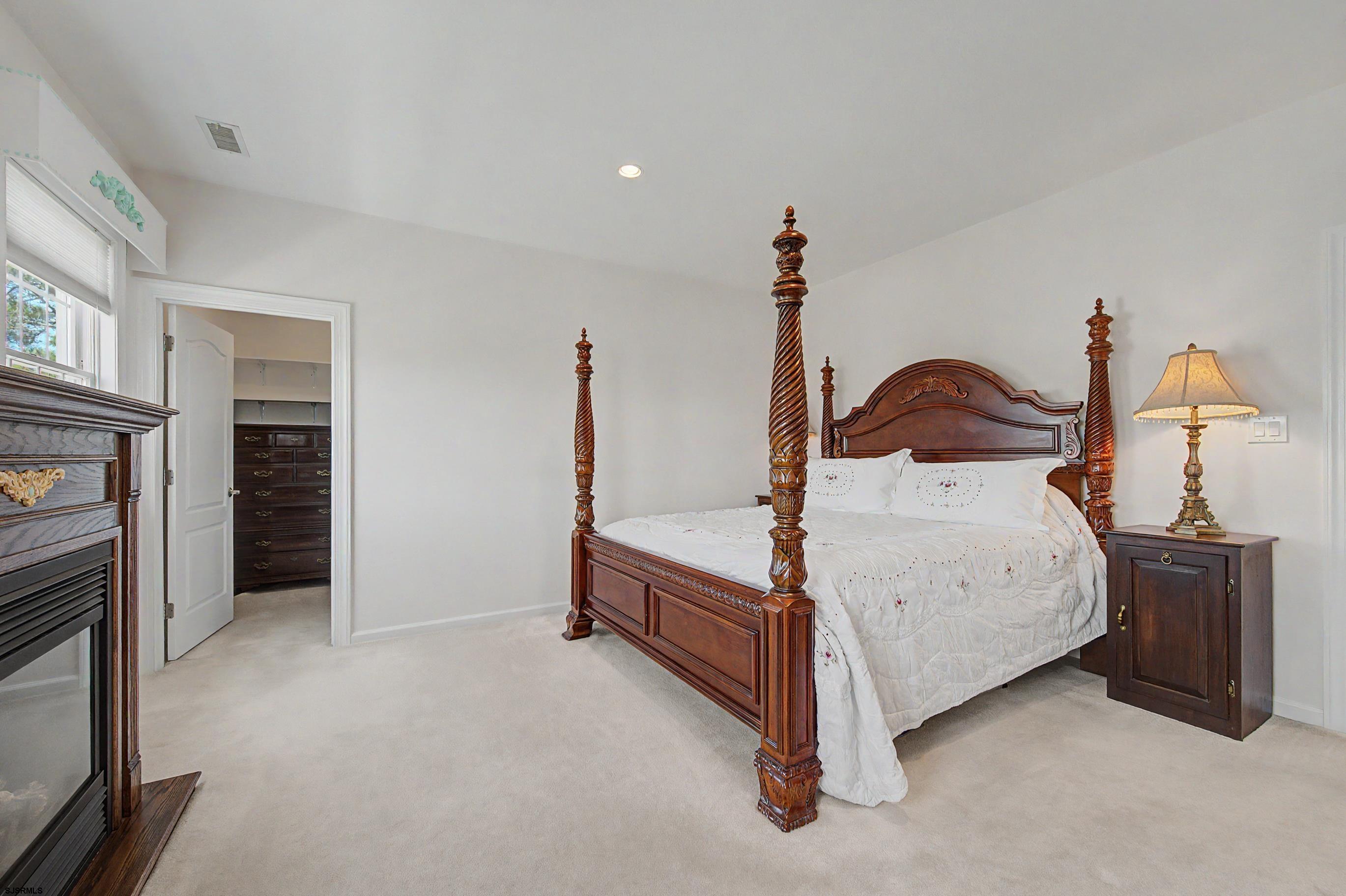 212 17th Street South Brigantine, NJ 08203 - Photo 24 of 37 a room with a bed and a fireplace